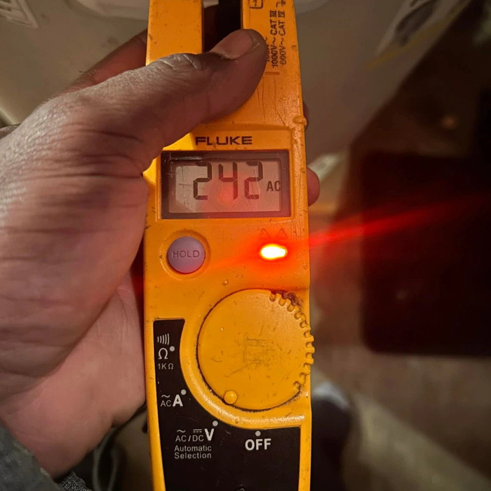 Electrical Troubleshooting in Chico, CA electrician using fluke multimeter during electrical troubleshooting and diagnosis in chico ca