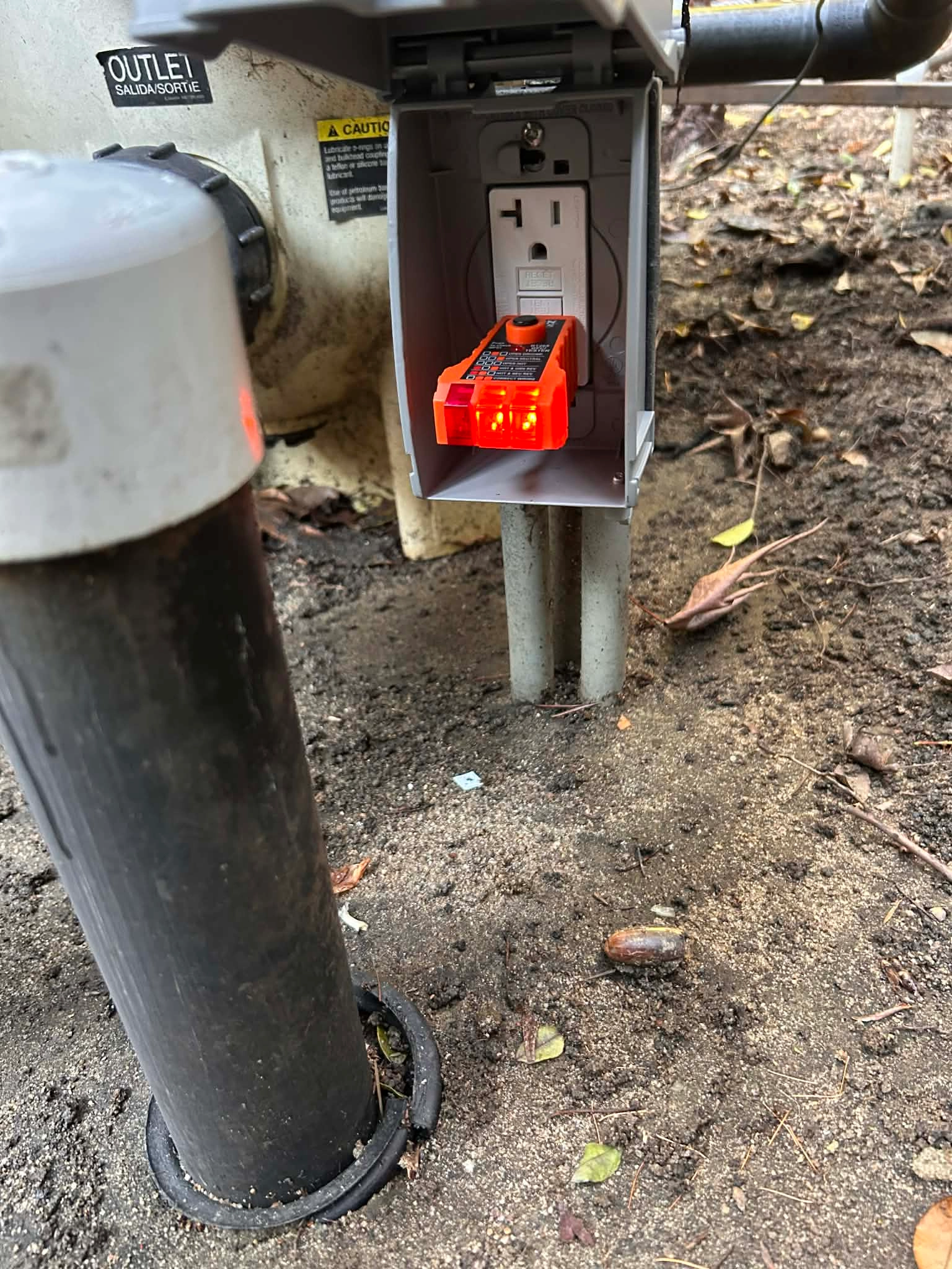 Electrical outlet being tested during a Stones Electric residential diagnostic visit
