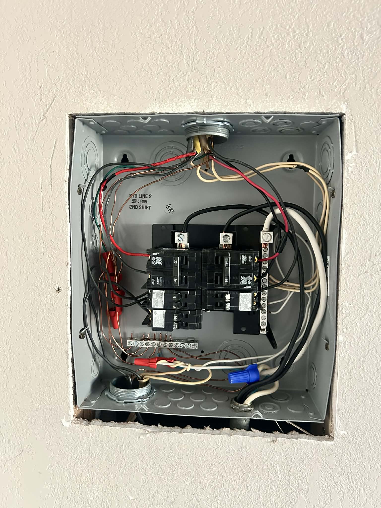 Residential electrical wiring exposed for repair after troubleshooting