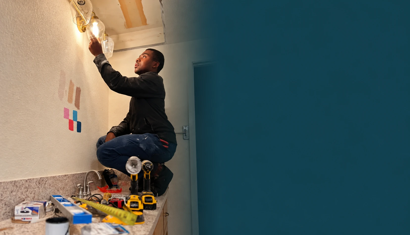 Adrian of Stones Electric working on a residential light fixture during electrical troubleshooting in Citrus Heights, CA.